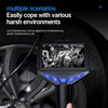 A handheld industrial borescope with a screen is shown against a blurred background of a car wheel.