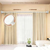 A non-puching telescopic rod is installed above a window, with a shower curtain hanging below.
