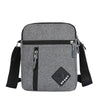 A gray lightweight crossbody sling bag with multiple zip pockets and black adjustable straps.