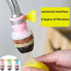 A close-up of a universal faucet water filter showing multiple layers of filtration and a yellow spray head being held by a h