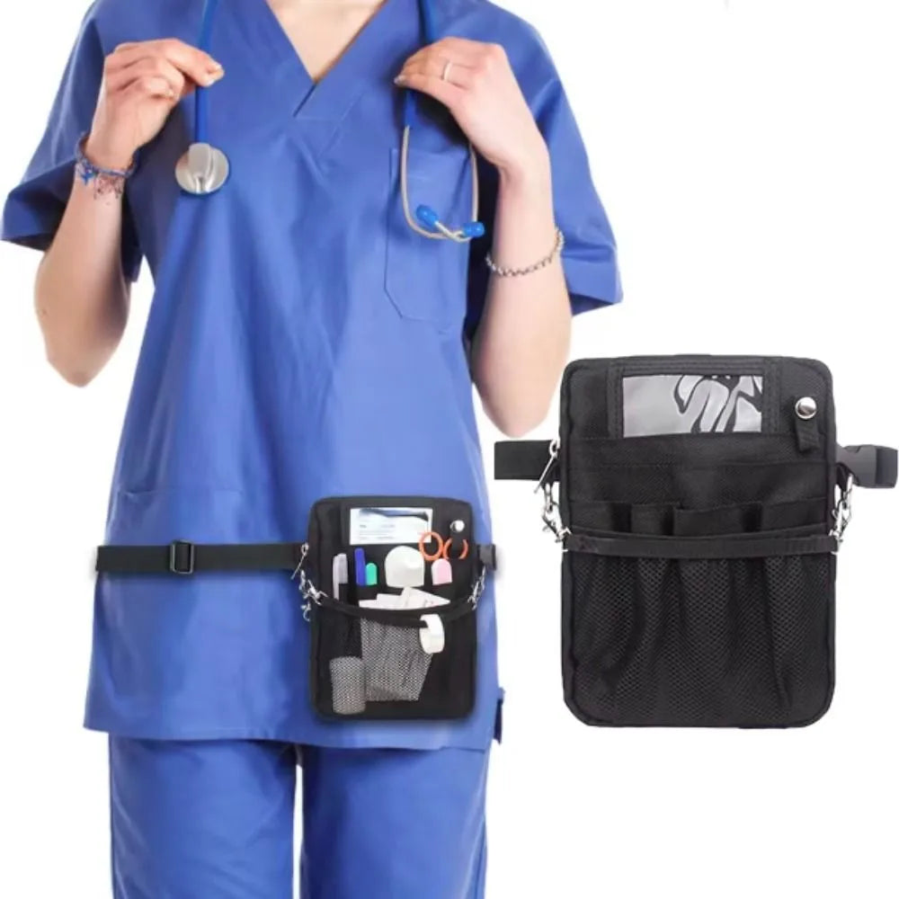 A nurse wearing blue scrubs holds a black multi-pocket crossbody fanny pack.