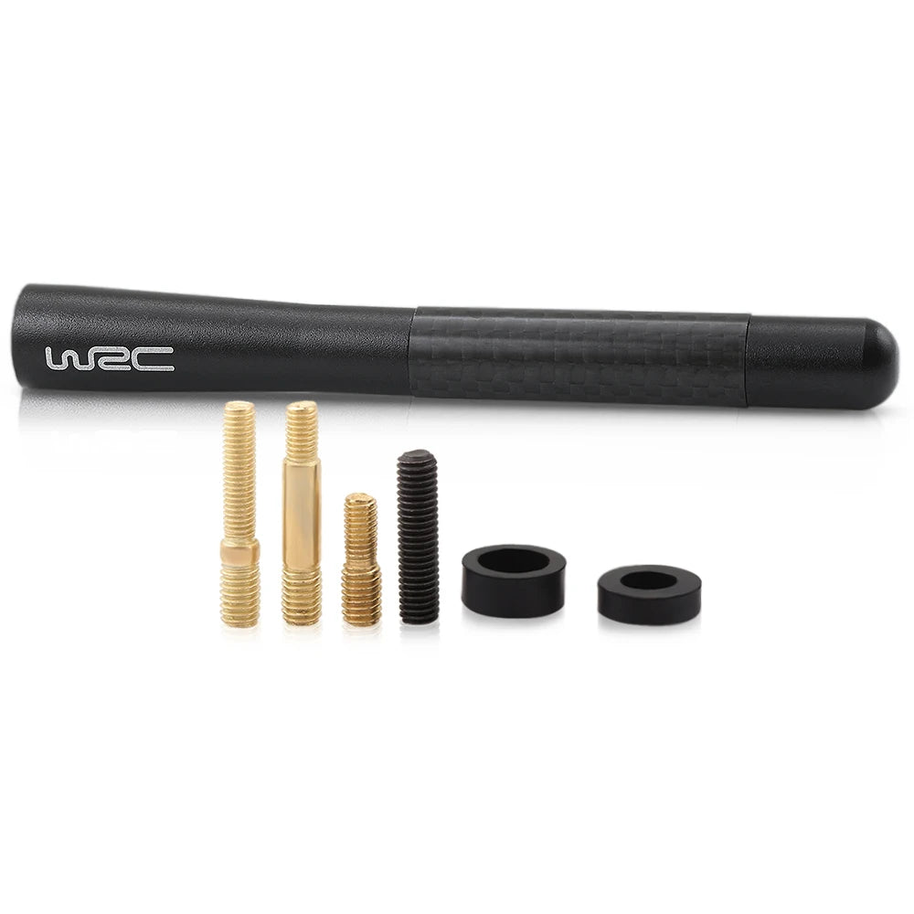 A black carbon fiber short radio antenna with several threaded metal components displayed on a white background.