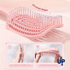 A pink volumizing detangling hair comb is shown with instructions for fitting the head shape and stretching the back contour.
