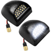 A black 18-LED license plate light module with electrical connectors.