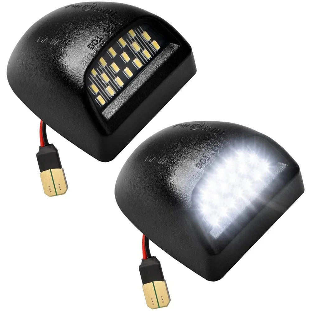 A black 18-LED license plate light module with electrical connectors.