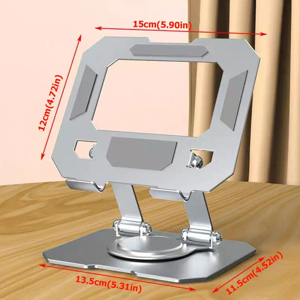 A silver foldable tablet stand with a rectangular frame and a circular base shown on a wooden surface.