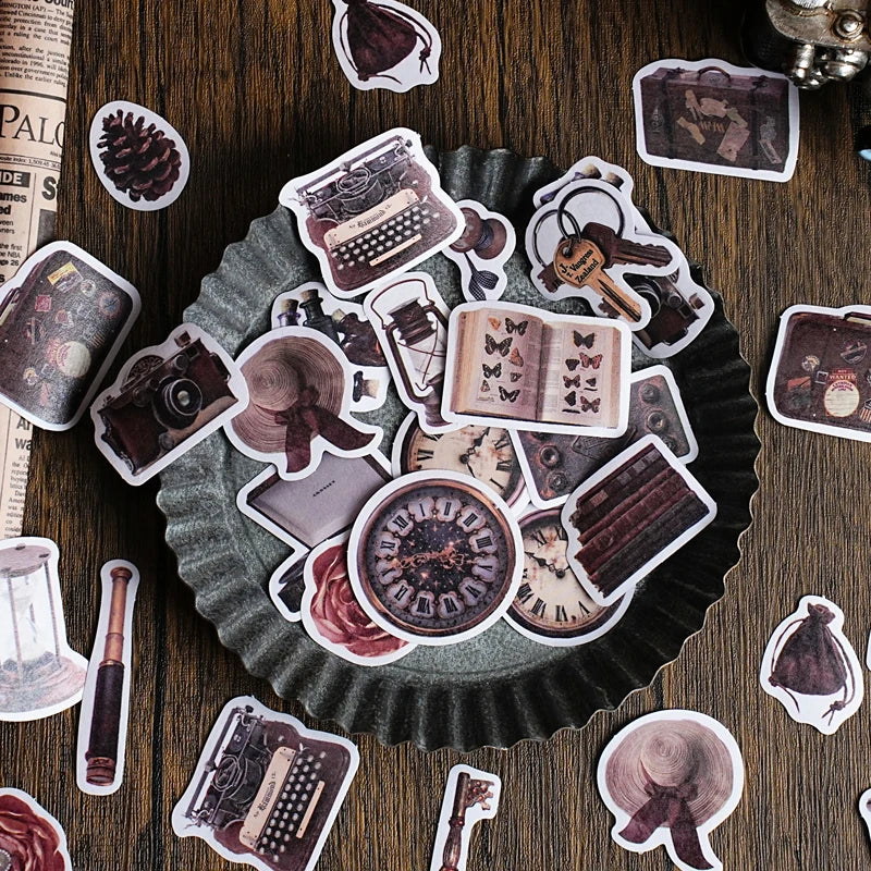 A collection of vintage metal-embossed washi stickers featuring various decorative elements for journaling and scrapbooking.