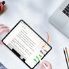 A hand writes on an iPad screen featuring a paper writing sensation effect.