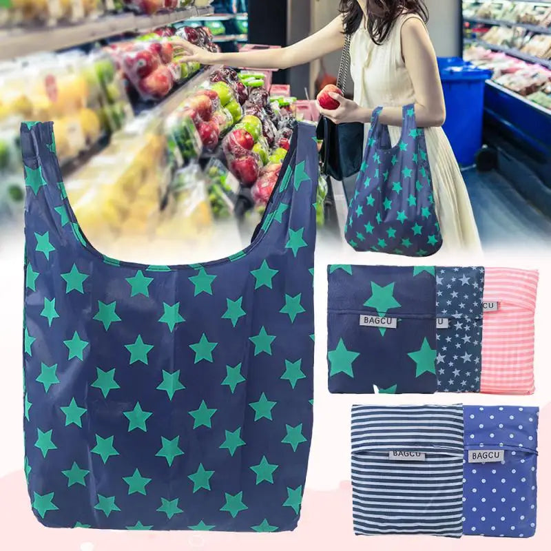 A dark blue reusable shopping bag with green stars is shown in a retail setting.