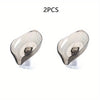 Two leaf design self-draining soap dishes with suction cups.