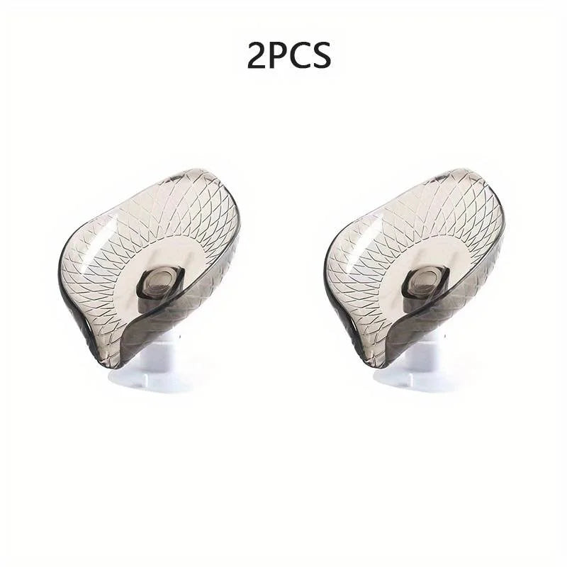 Two leaf design self-draining soap dishes with suction cups.