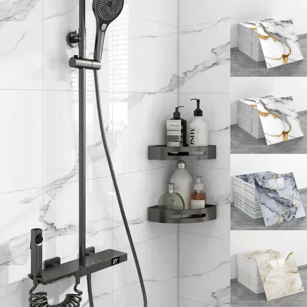 A black shower system mounted on a white marble tiled wall with various skincare products displayed nearby.