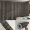 Roll of self-adhesive wood grain wallpaper featuring vertical dark stripes for wall decoration