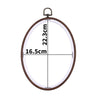 A circular wooden embroidery hoop with measurements marked on it, ready for cross-stitch and needlework.