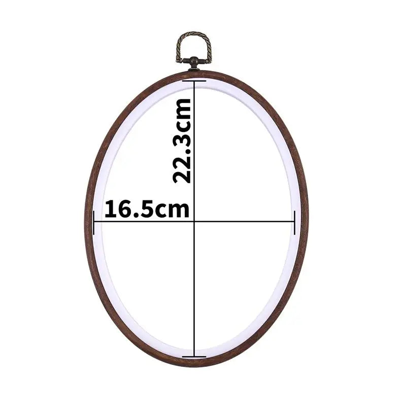 A circular wooden embroidery hoop with measurements marked on it, ready for cross-stitch and needlework.
