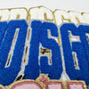 Embroidered chenille iron-on patch featuring the text God Is Good in blue and gold thread.