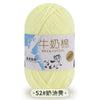 A ball of yellow milk cotton blend yarn for knitting and crochet projects.
