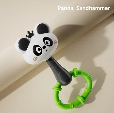A panda-themed sandhammer toy with a black handle and green ring, designed for baby sensory play.