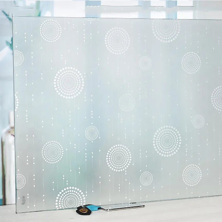 Frosted privacy window film with a light blue stripe pattern displayed on a glass panel.