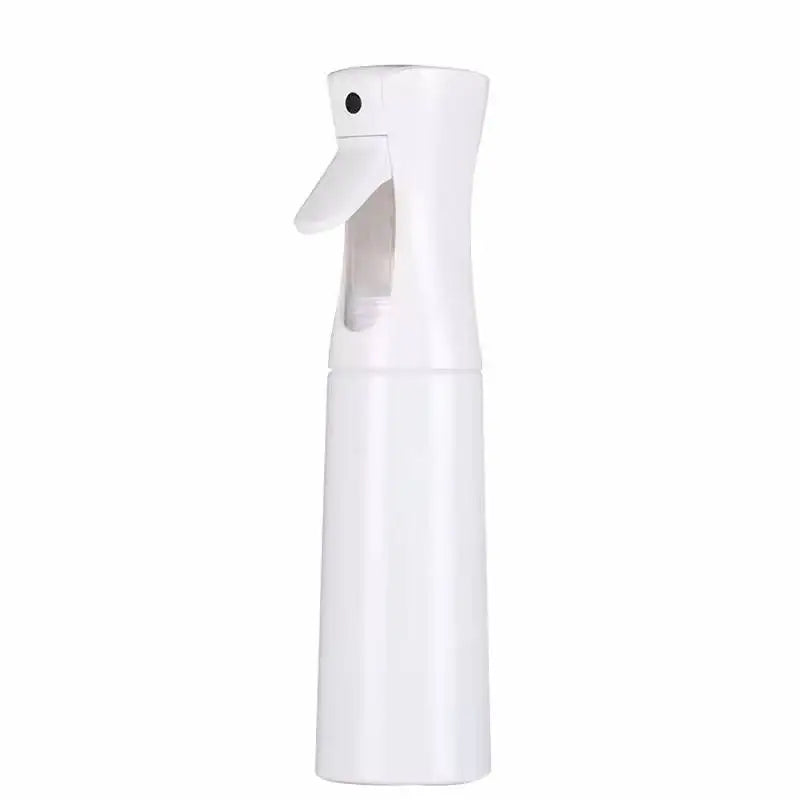 A white refillable mist spray bottle with a nozzle, used for hair, skin, and home products.