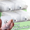A hand holds a transparent self-adhesive hook product showing multiple clear plastic hooks for wall mounting.