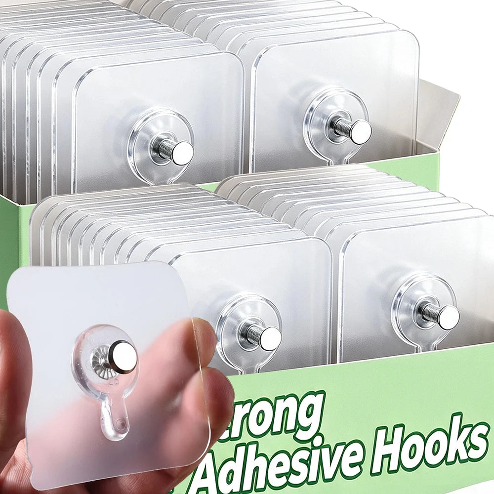 A hand holds a transparent self-adhesive hook product showing multiple clear plastic hooks for wall mounting.