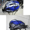 A black and blue universal motorcycle bungee cargo net with scratch-free hooks mounted on a rack.
