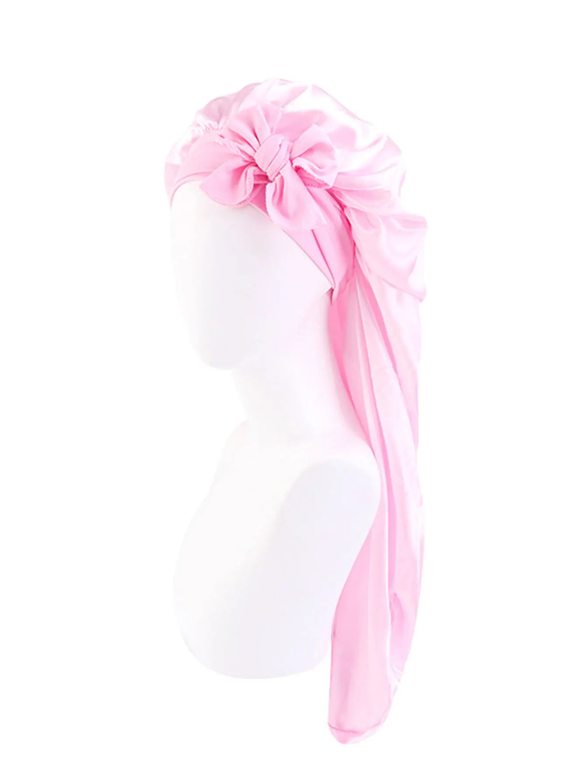 Pink satin sleep bonnet with an adjustable tie displayed on a white mannequin head.
