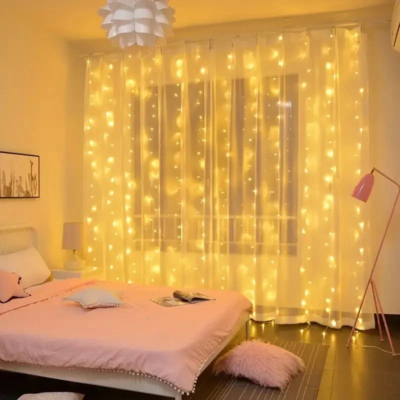 USB fairy string lights illuminating a bedroom window with warm yellow light