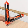 An orange contour gauge scribe tool is held by a hand, demonstrating its use for woodworking or DIY projects.