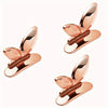 A rose gold touch-free toilet seat lifter with a flush button shown from above.