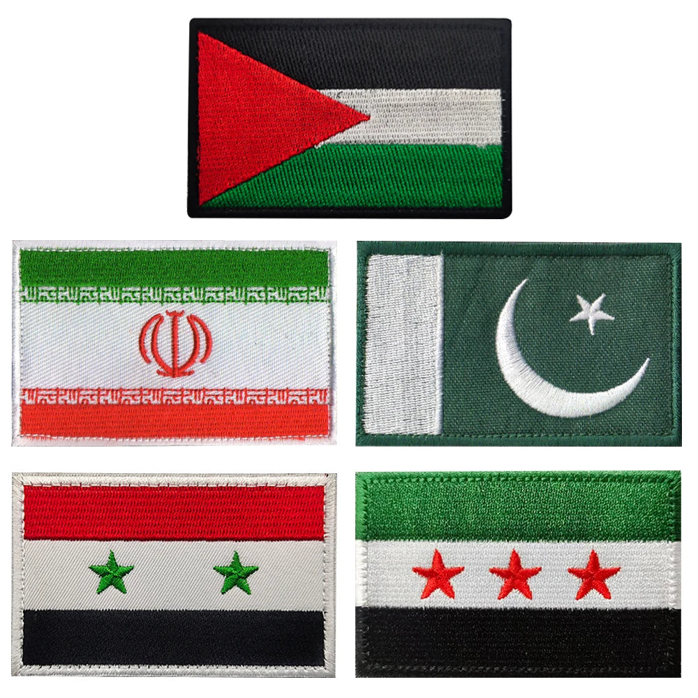 Four embroidered flag patches featuring various national flags.