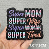 Black embroidered iron-on patches with purple, teal, and pink text reading Super Mom Super Wife Super Woman and Tired
