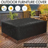 Black outdoor furniture cover protecting a wooden table and chairs from the elements.