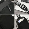 Black canvas chest bag with a zipper closure and a black strap featuring white text