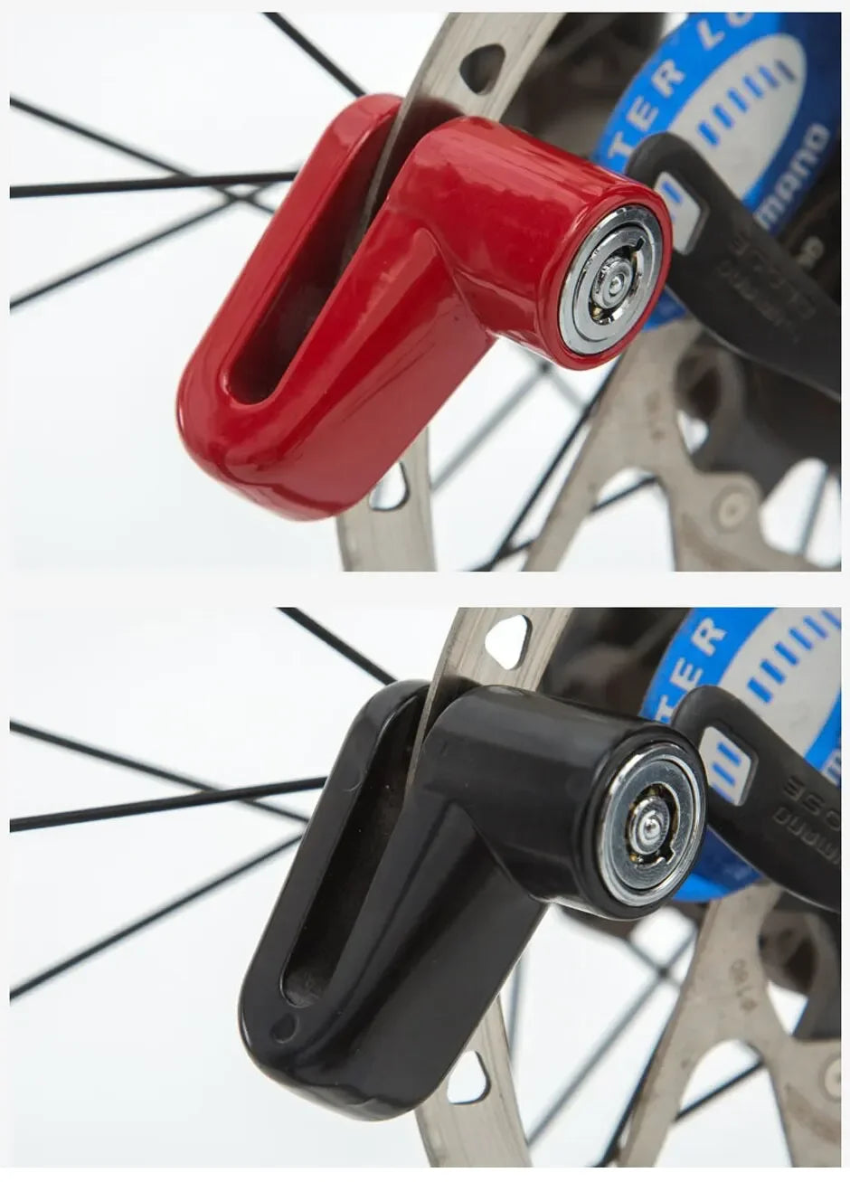 A close-up view of a red anti-theft disc brake lock for a motorcycle wheel.