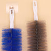 A white bendable fan duster brush with a long handle and a dark brown bristled head is shown.