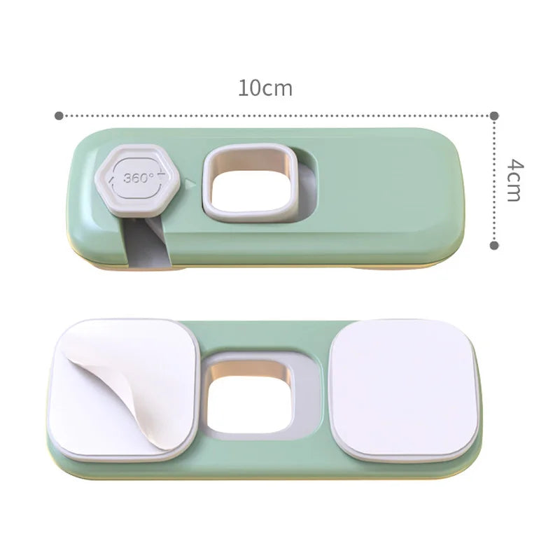 A light green child safety cabinet lock featuring a 360 degree rotating mechanism and a rectangular opening.