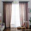 Brown sheer voile curtains with a rod pocket filtering light through a window.
