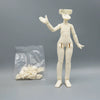 A white articulated BJD collectible figurine standing next to a clear plastic bag containing small white parts.