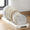 A white organizer rack holds a stack of round plates and bowls with adjustable dividers.