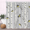 Gray fabric shower curtain featuring black and white birch tree silhouettes and yellow birds