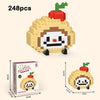 A set of 248 micro building blocks forming a cute figurine of a smiling face with a tomato on top.