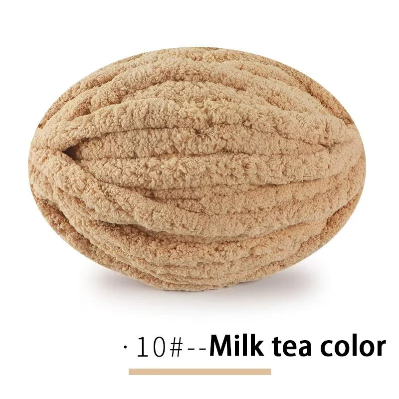A ball of light brown chenille yarn labeled as Milk tea color for hand knitting