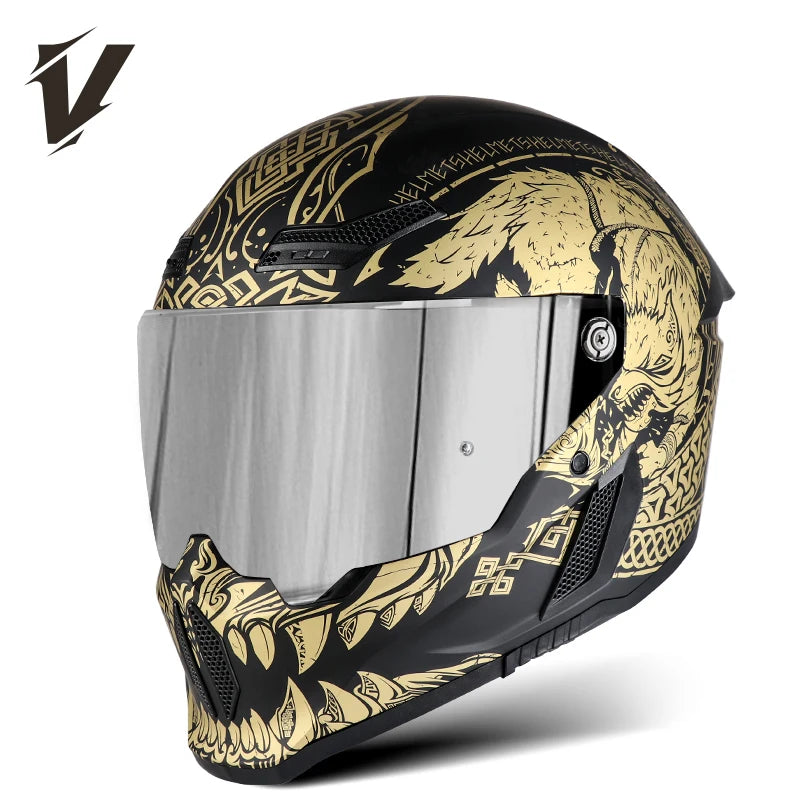 A black full-face motorcycle helmet featuring gold and black graphic designs with a silver visor.
