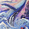 A diamond painting depicting a whale breaching through turbulent blue and purple waves under a sunset sky.