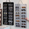 A black felt eyewear organizer with 16 slots is displayed on a white surface.