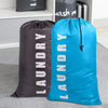 A dark gray reusable laundry storage bag next to a bright blue one, both with drawstring closures.