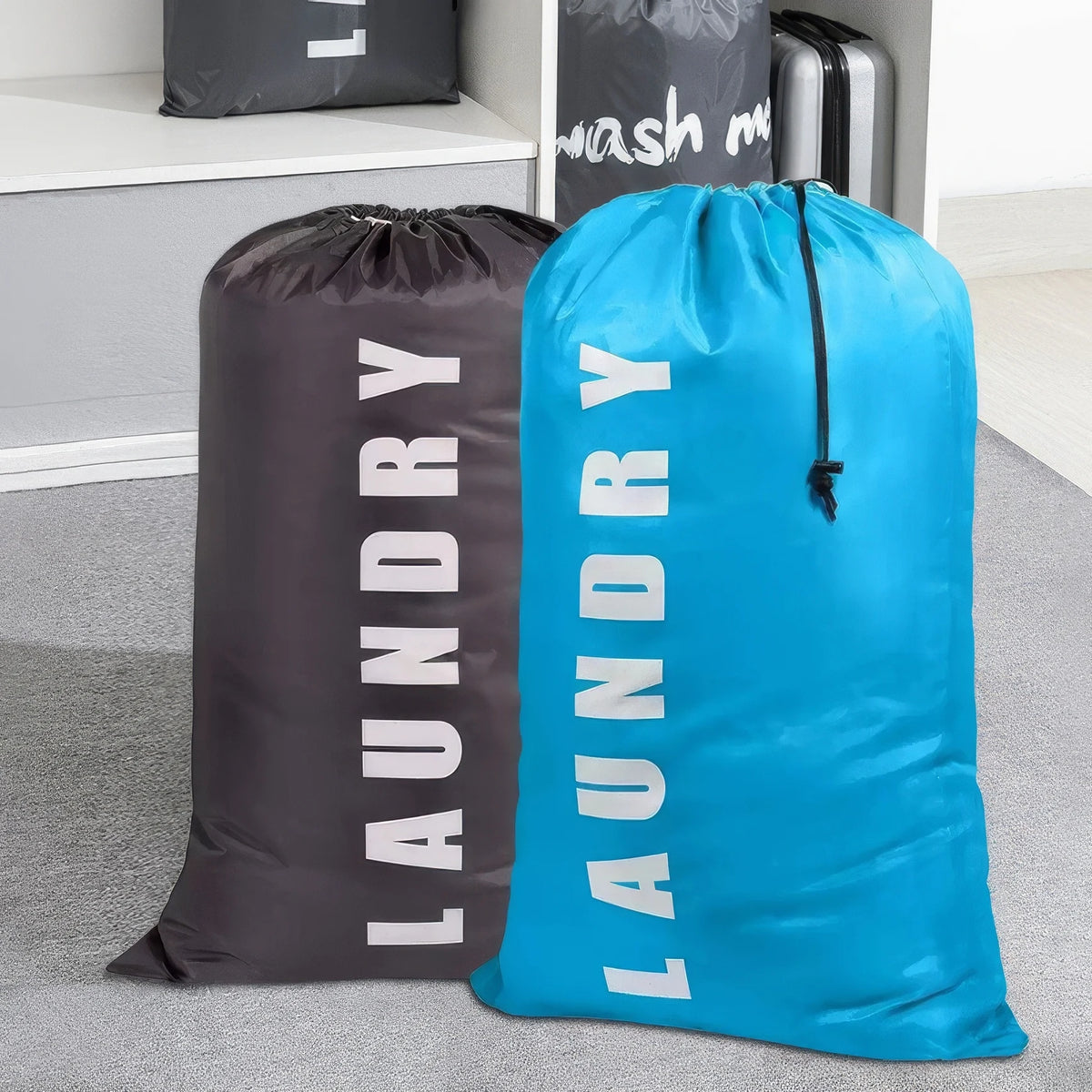 A dark gray reusable laundry storage bag next to a bright blue one, both with drawstring closures.