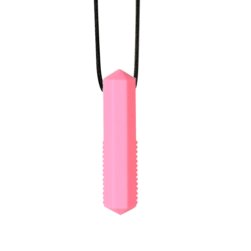 A pink silicone sensory chew necklace pendant with a black cord.